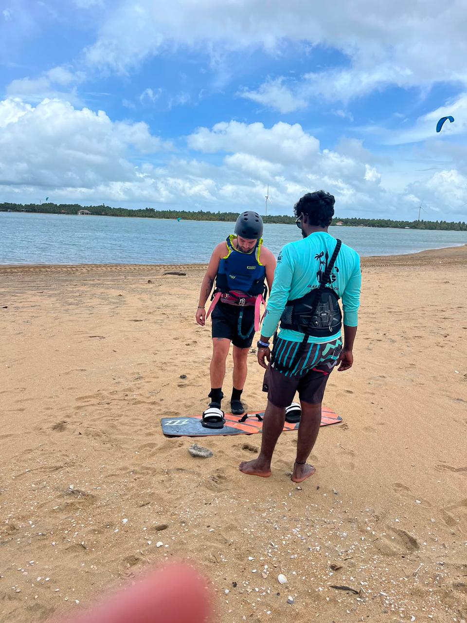 IKO certified instructor teaching a kitesurfing lesson on the beach in Kalpitiya