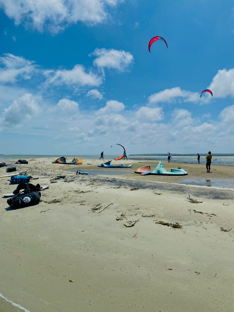 Kitesurfers and their kites on the shore at Mini Vella near Kalpitiya, Sri Lanka